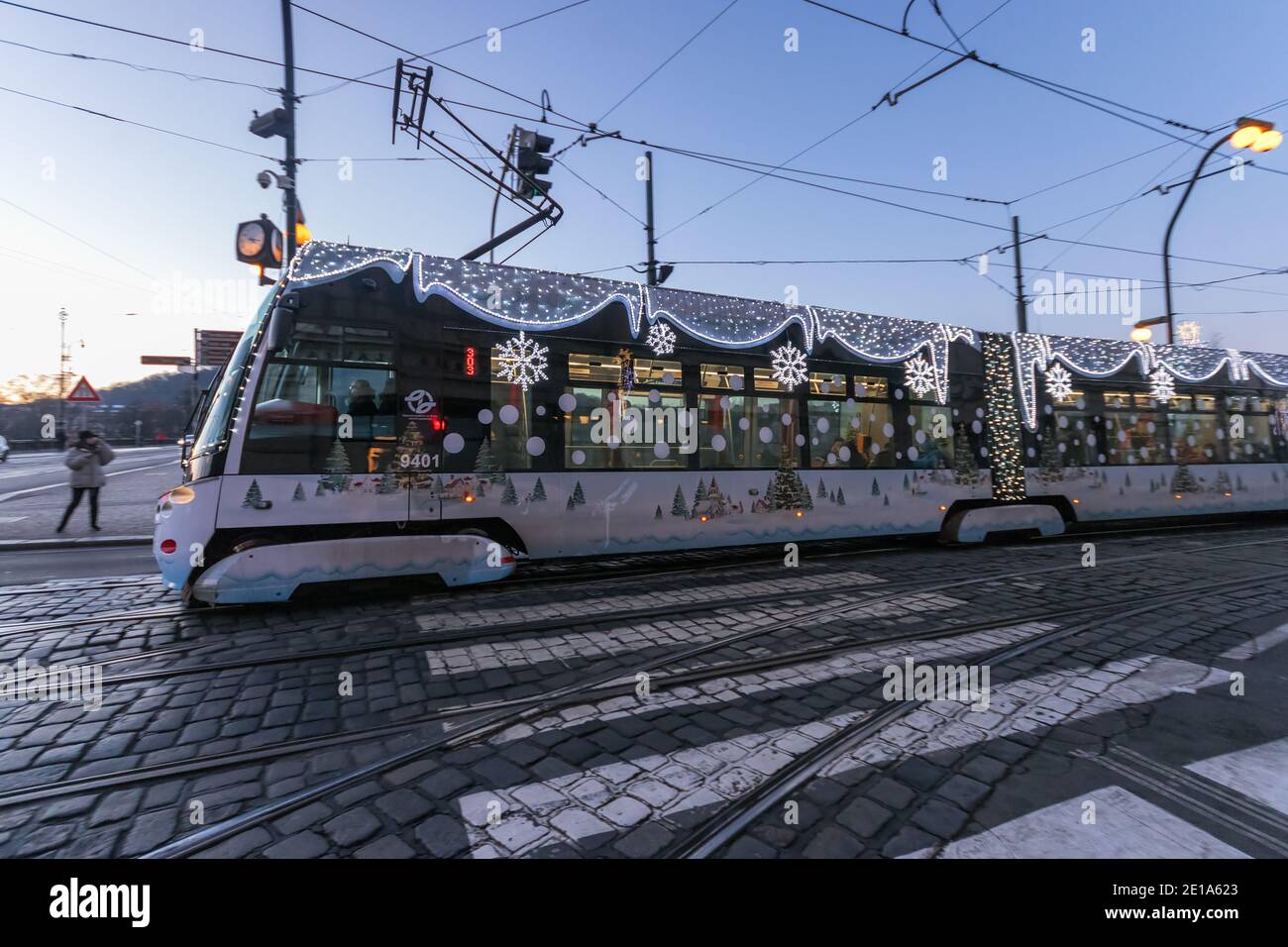 PRAGUE - December 30: Tram Skoda 15T with Christmas decoration and lights in the close neigborhood of National theatre on December 30, 2020 in Prague, Stock Photo