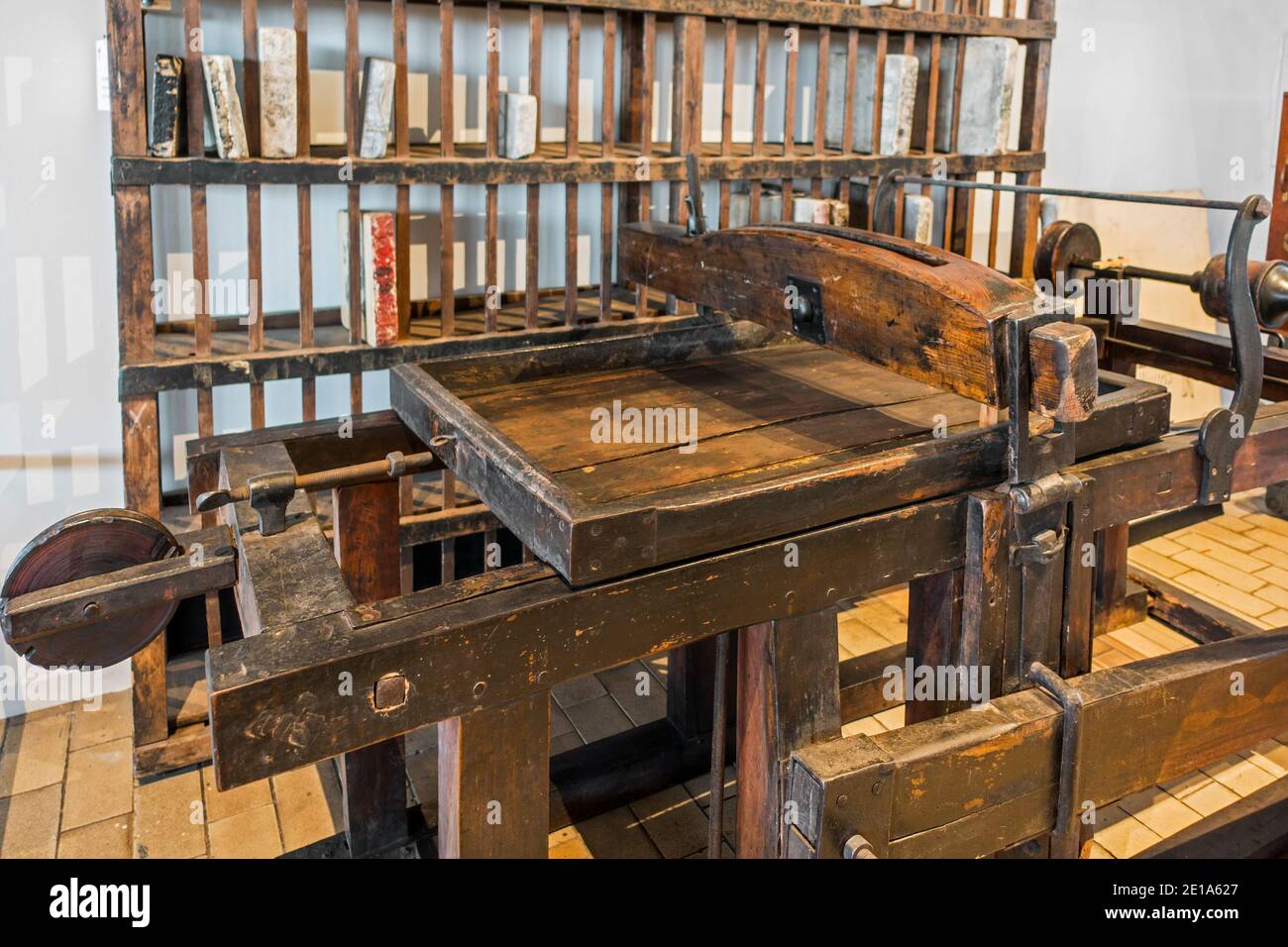 Wooden early 19th century lithographic press, manually operated using a star wheel Stock Photo