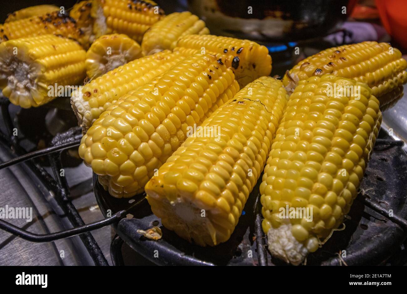 Detailed group of cobs being grilled on a propane gas stove Stock Photo