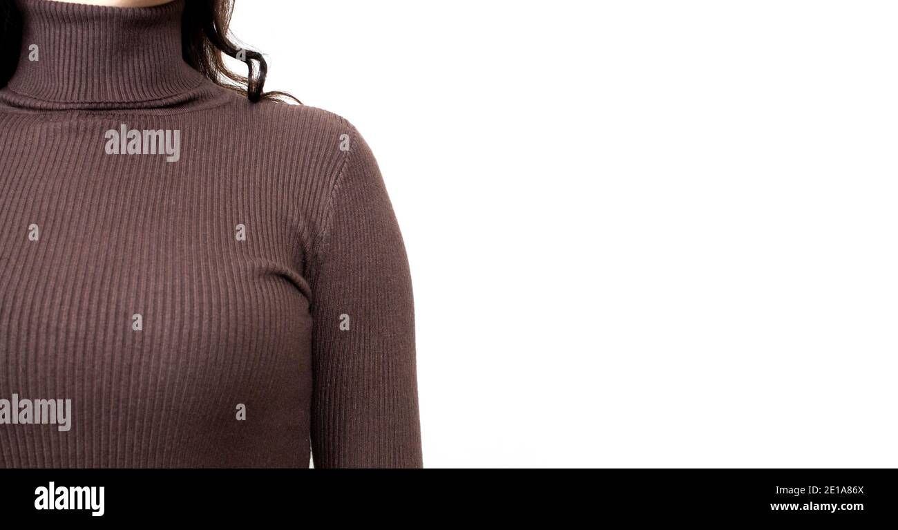 Young woman wearing brown sweater or roll-neck close-up. Banner with copy space Stock Photo