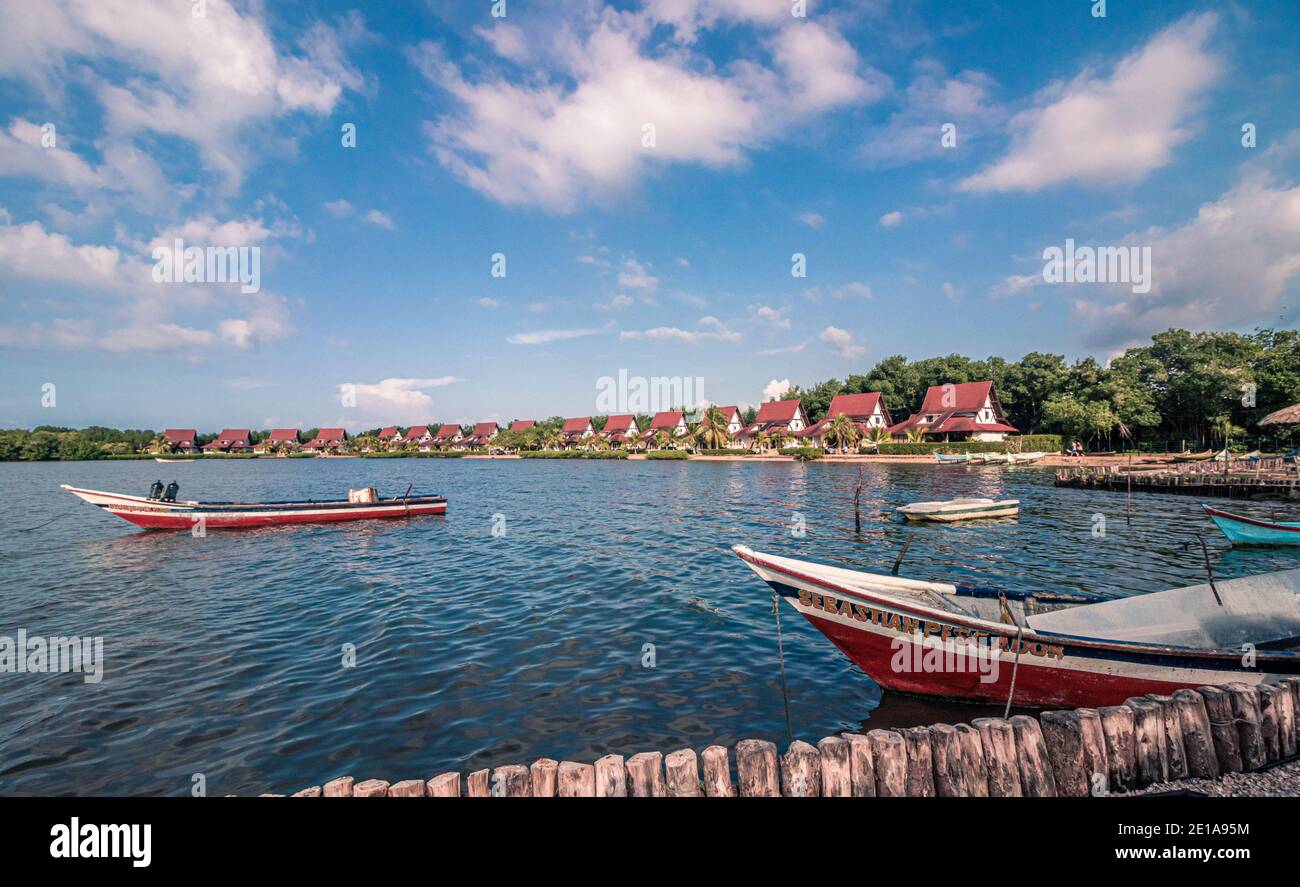 Fishing boats near its docking places, some of them are parked and tied on the dock Stock Photo