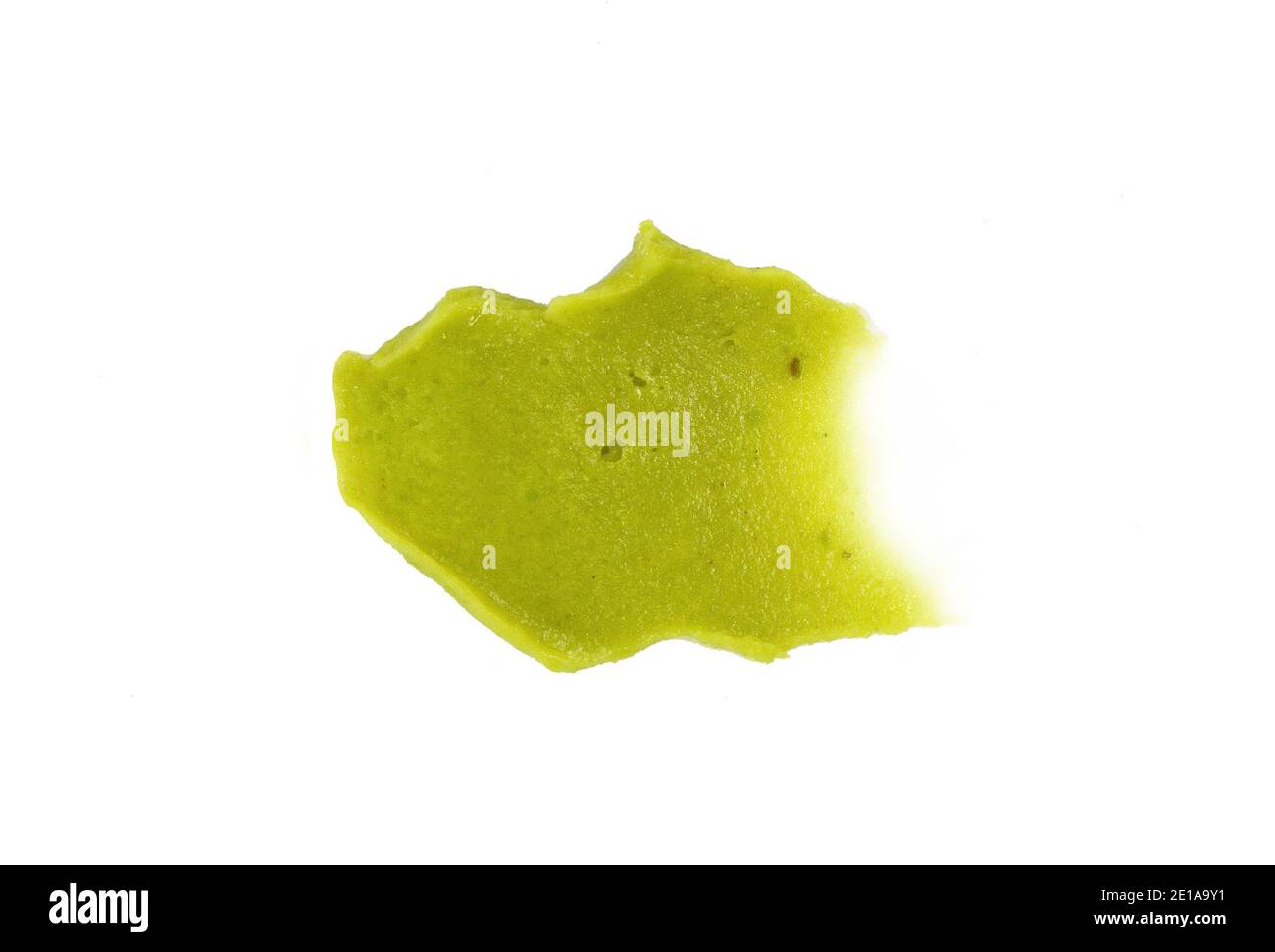 Puddle of green wasabi dressing or wasabi sauce spot isolated on white