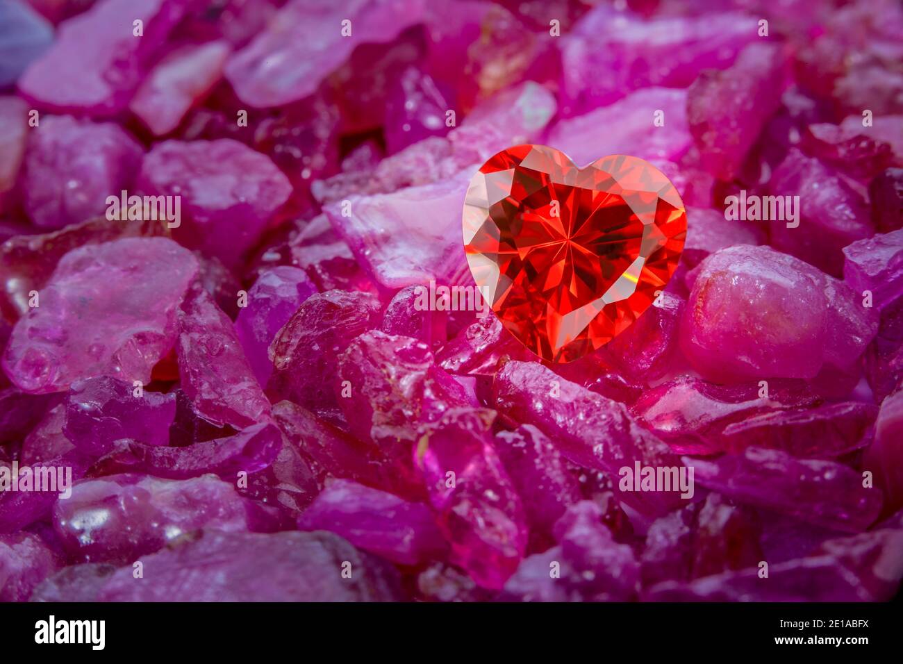 heart shaped ruby red diamond on raw Ruby Gemstone on raw sky blue