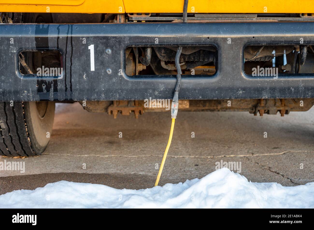 A vehicle block heater is used in cold climates to warm an engine prior