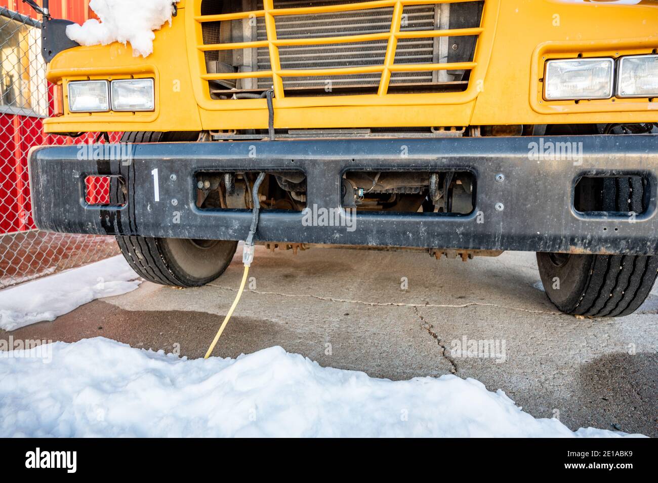 A vehicle block heater is used in cold climates to warm an engine prior