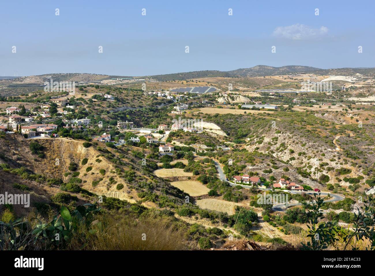 Wide view of interior landscape of Cyprus in the Pissouri region with scattered houses and hills Stock Photo