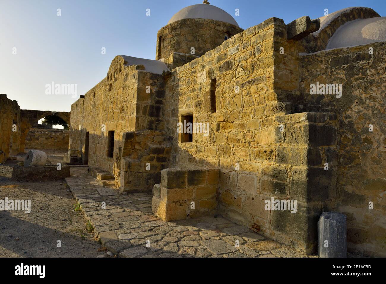 Old stone built Greek Orthodox church from about 12th to 13th century with remains of stone arches from earlier structure, Panagia Katholiki, Kouklia, Stock Photo
