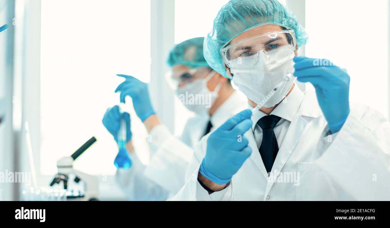 background image of a laboratory assistant in a medical laboratory ...