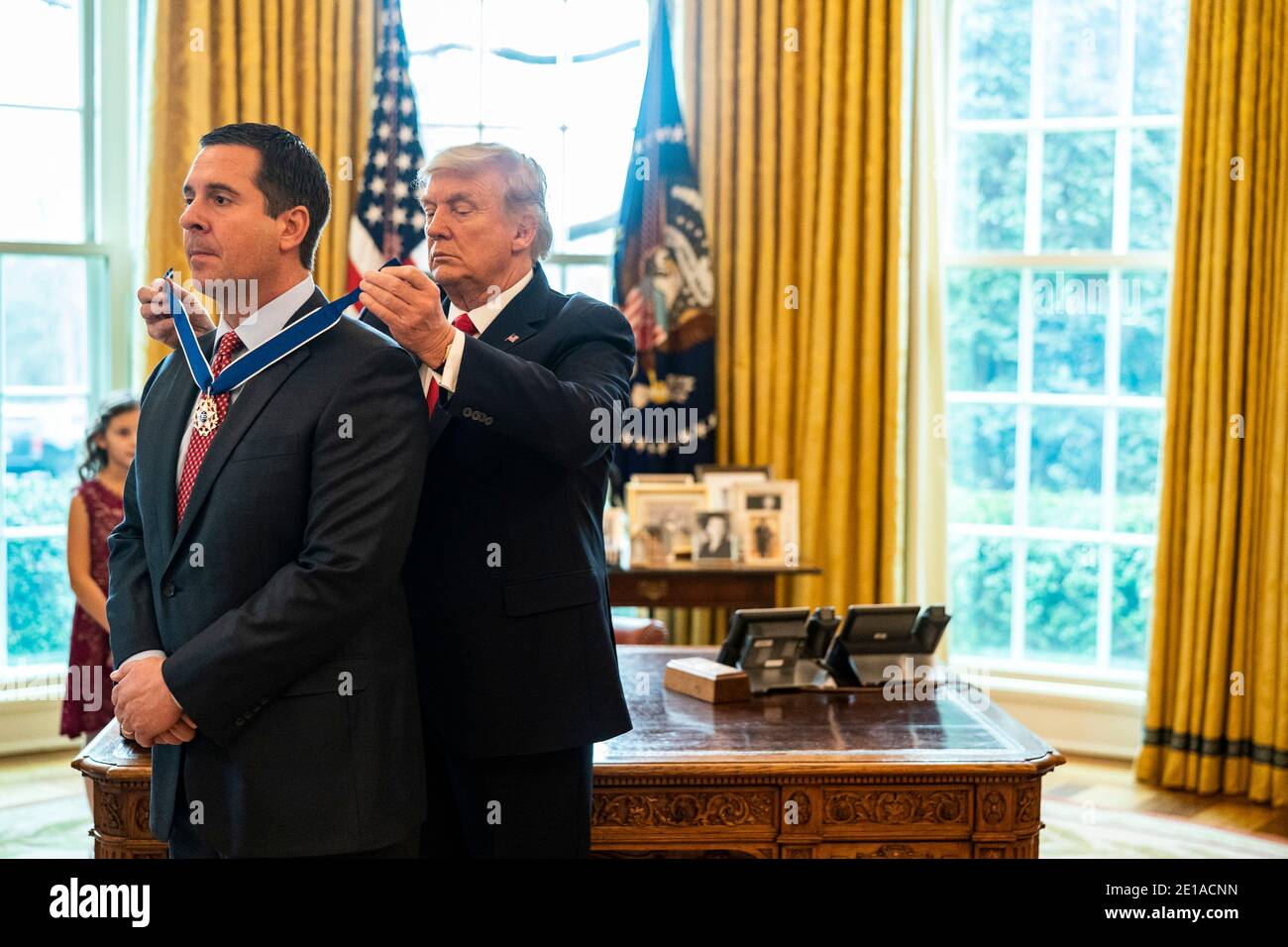 Washington, United States Of America. 04th Jan, 2021. U.S President Donald Trump presents Rep. Devin Nunes the Medal of Freedom in an Oval Office ceremony at the White House January 4, 2021 in Washington, DC Credit: Planetpix/Alamy Live News Stock Photo