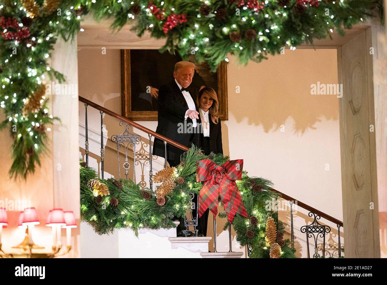 U.S President Donald Trump and First Lady Melania Trump walks down the grand staircase as they arrive for the Congressional Ball in the Grand Foyer of the White House December 10, 2020 in Washington, D.C. Stock Photo