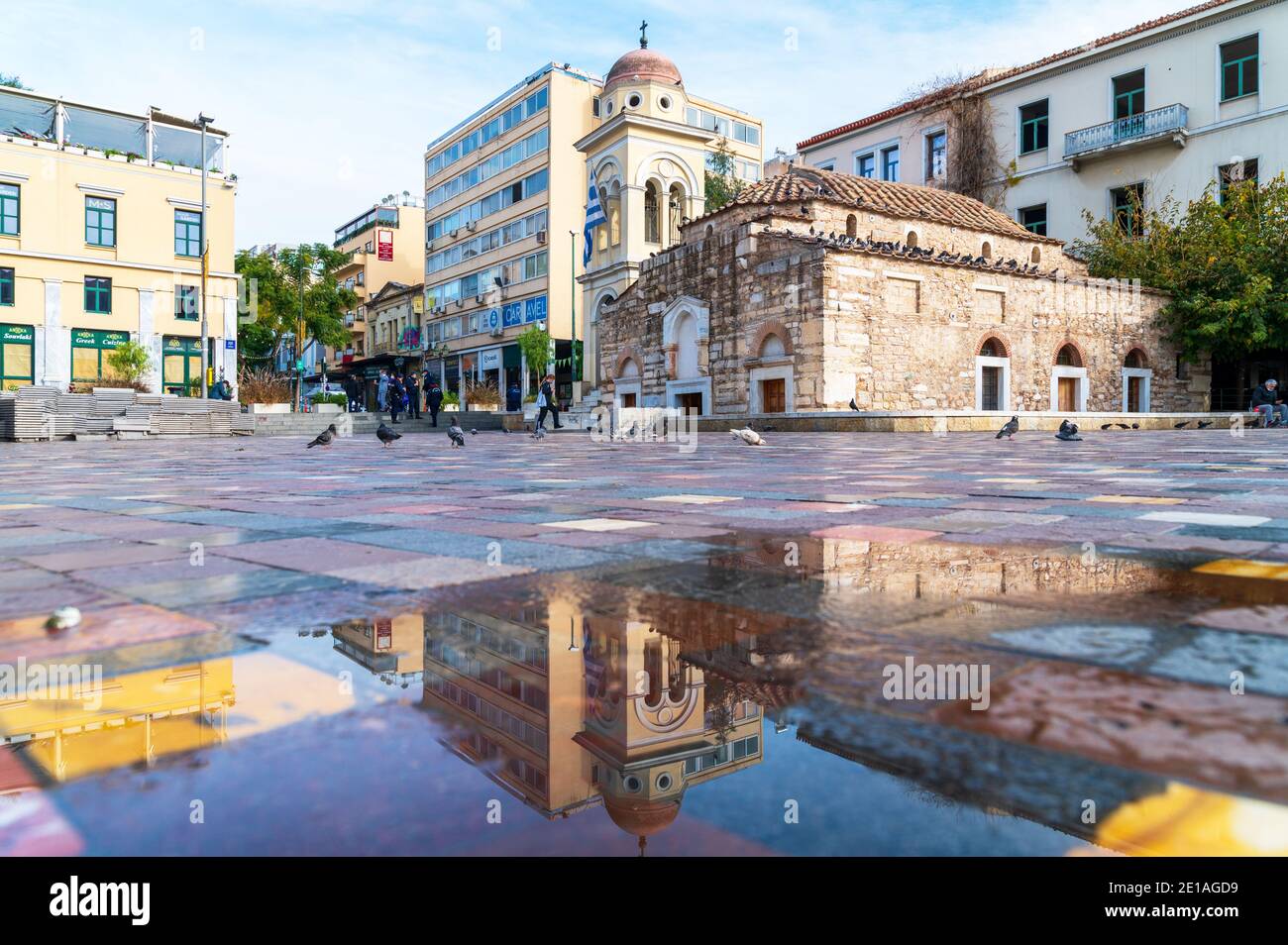 Greek orthodox church reflection in Monastiraki square of Athens, Greece Stock Photo