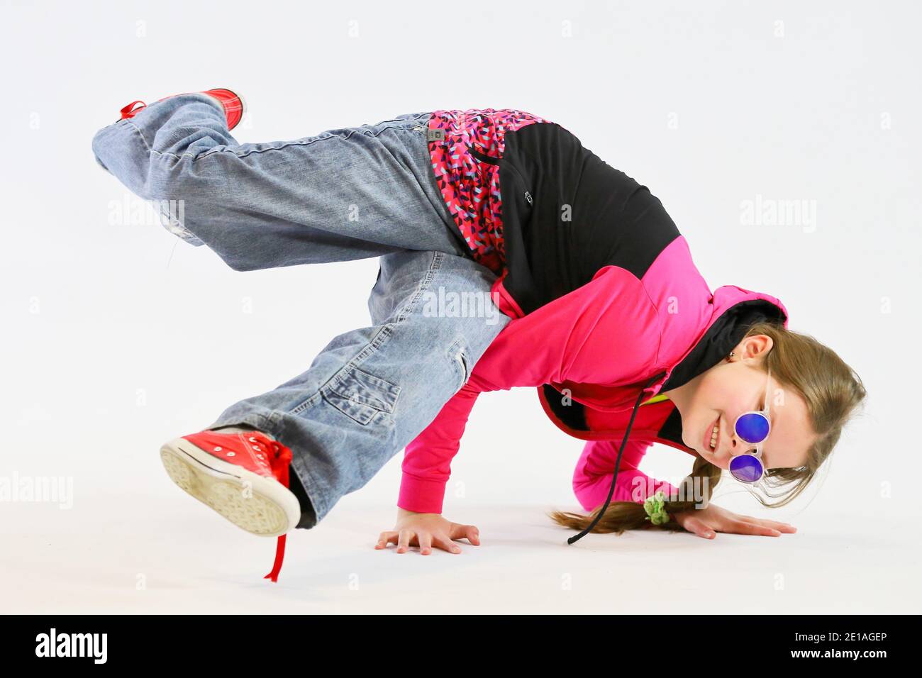 little girl in a difficult breakdance position Stock Photo