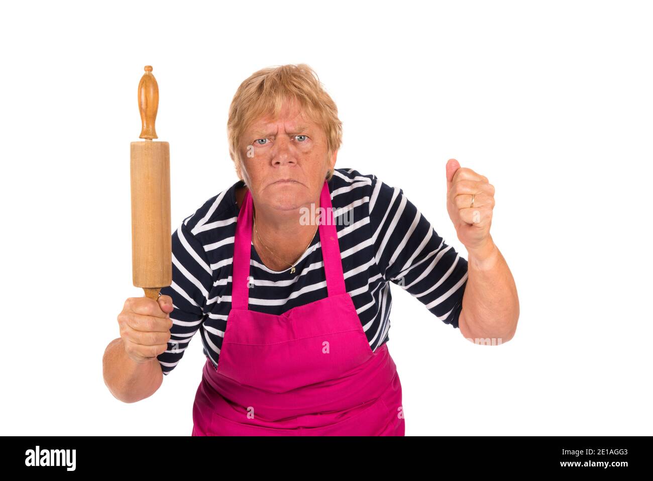 Very angry elder woman with pin roller isolated over white background Stock Photo