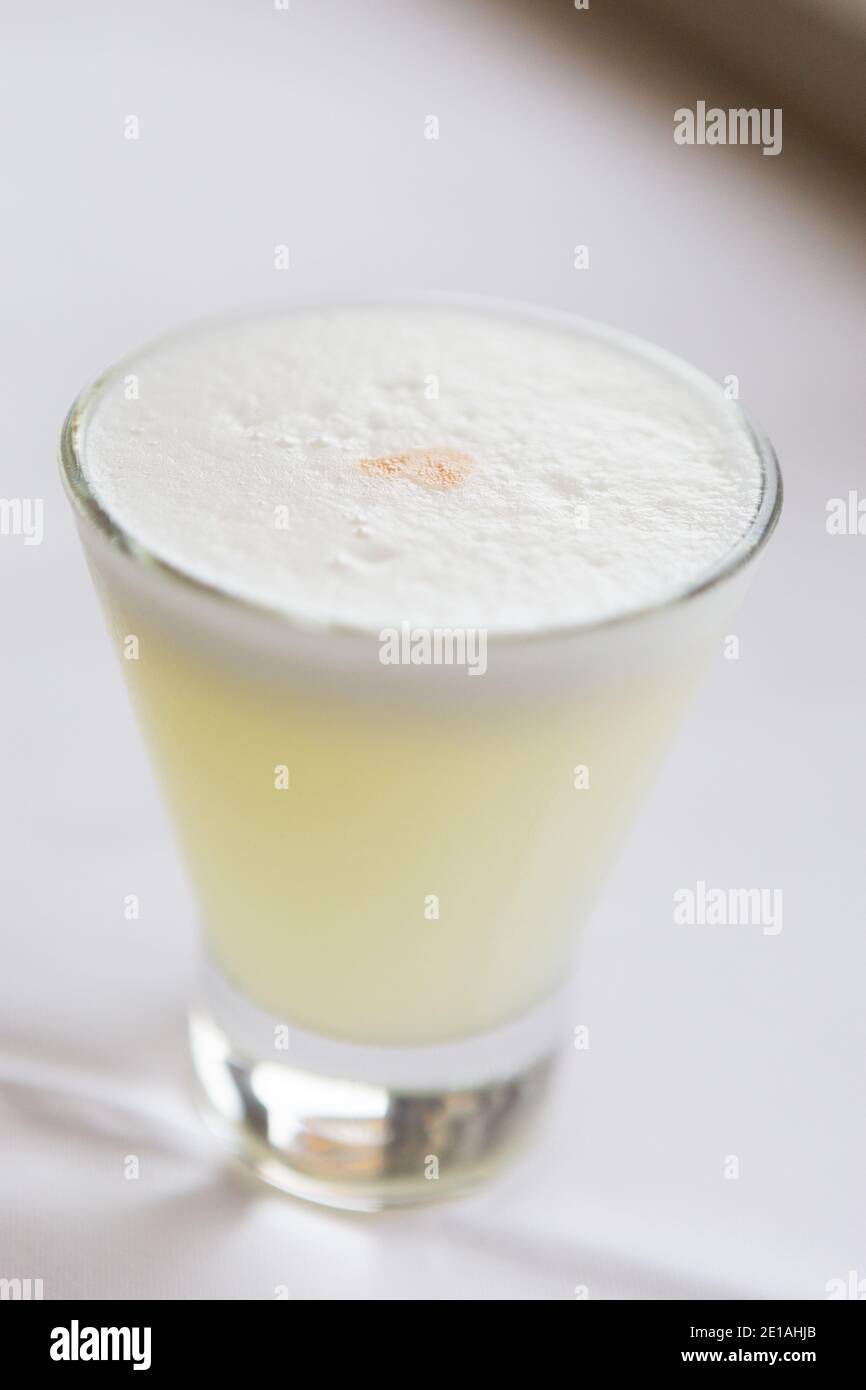 Glass of Pisco Sour, the national drink Stock Photo