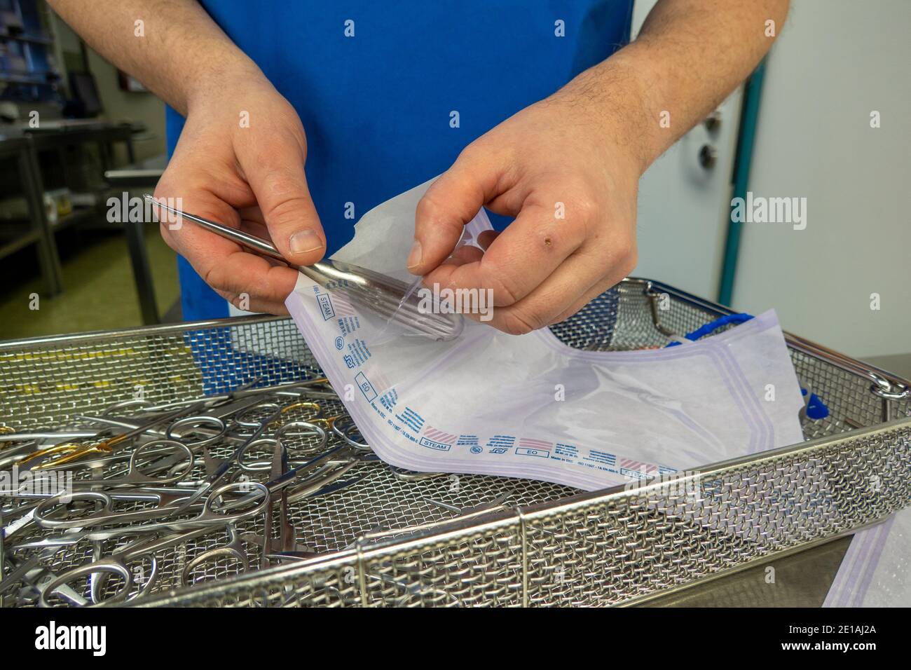 cleaned surgical instruments are put into a bag for steam sterilization