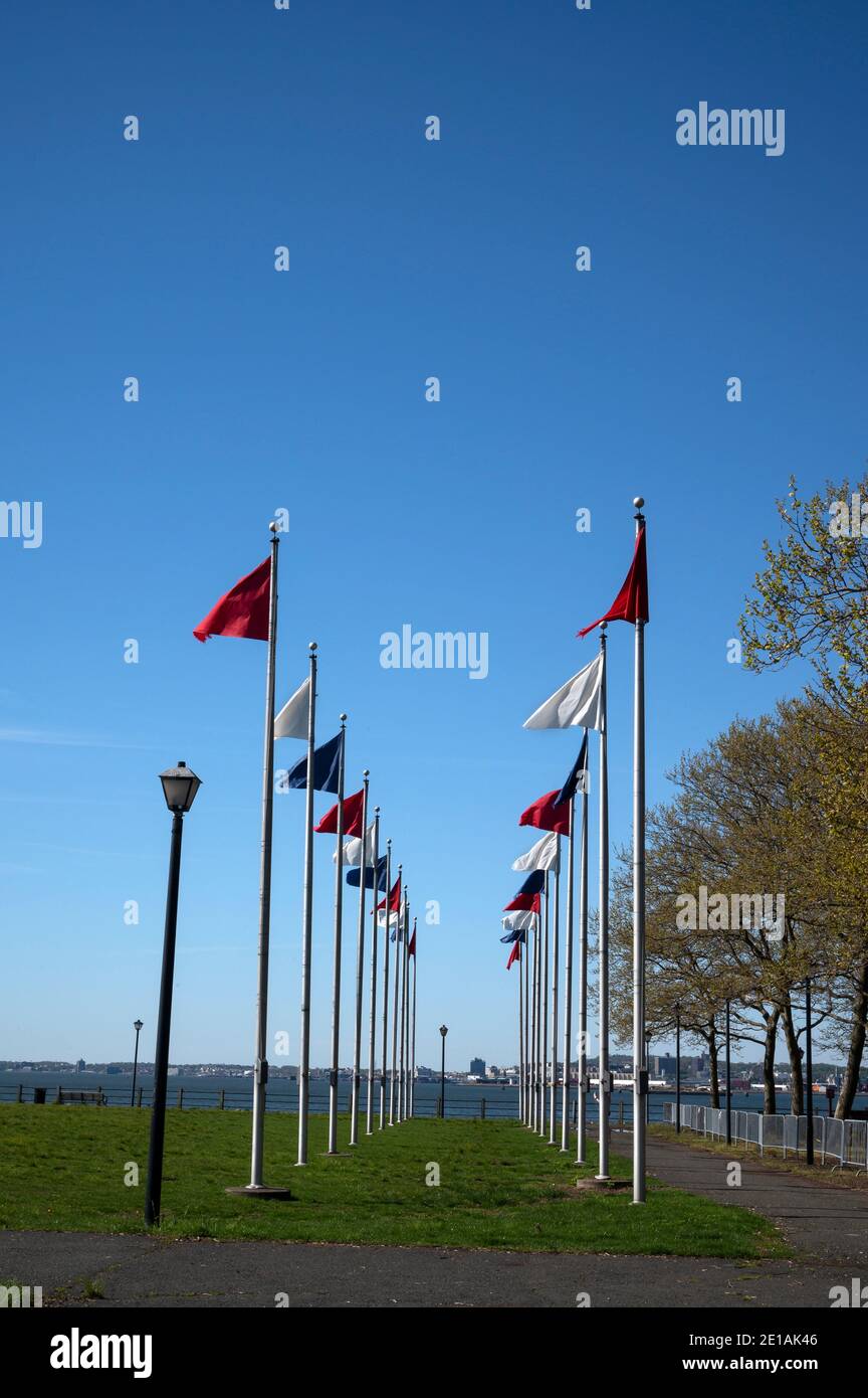 Flags on flag poles in Liberty State Park. Stock Photo