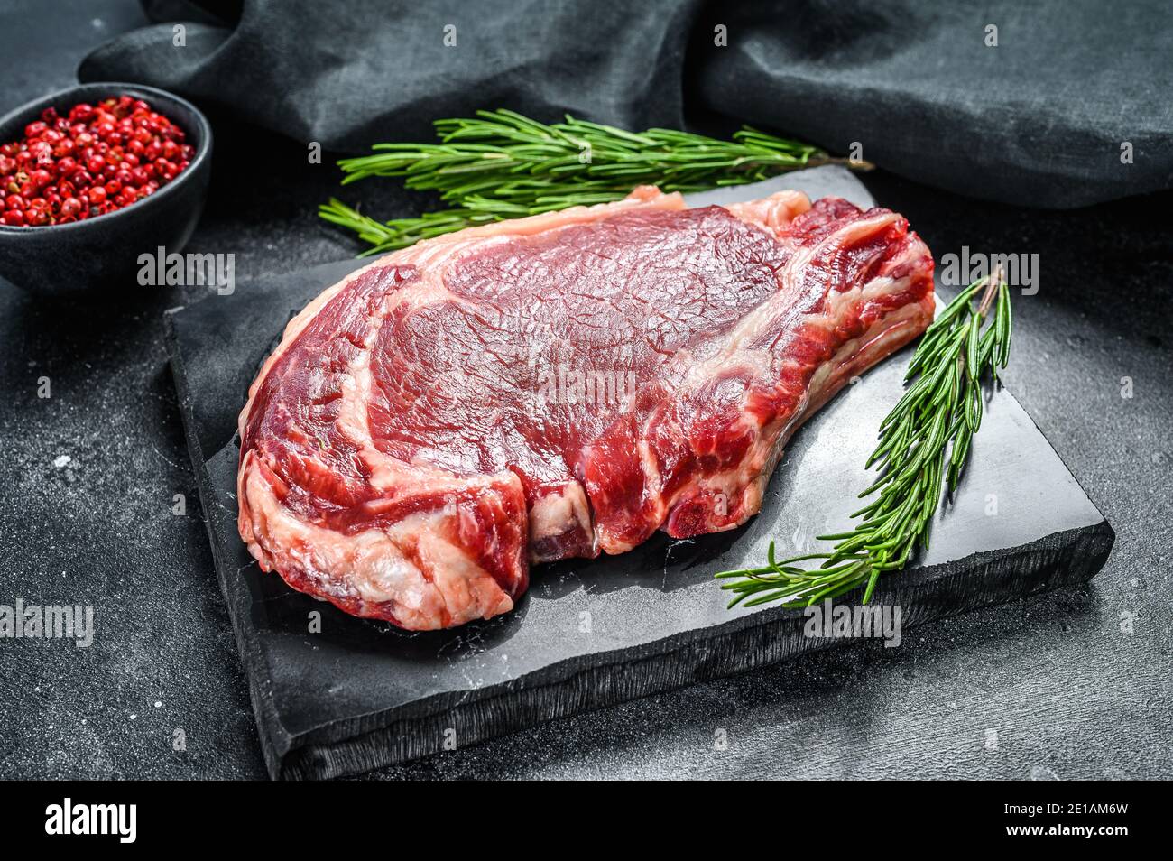 Rib eye or cowboy steak. Raw Marble beef black Angus, ribeye. Back