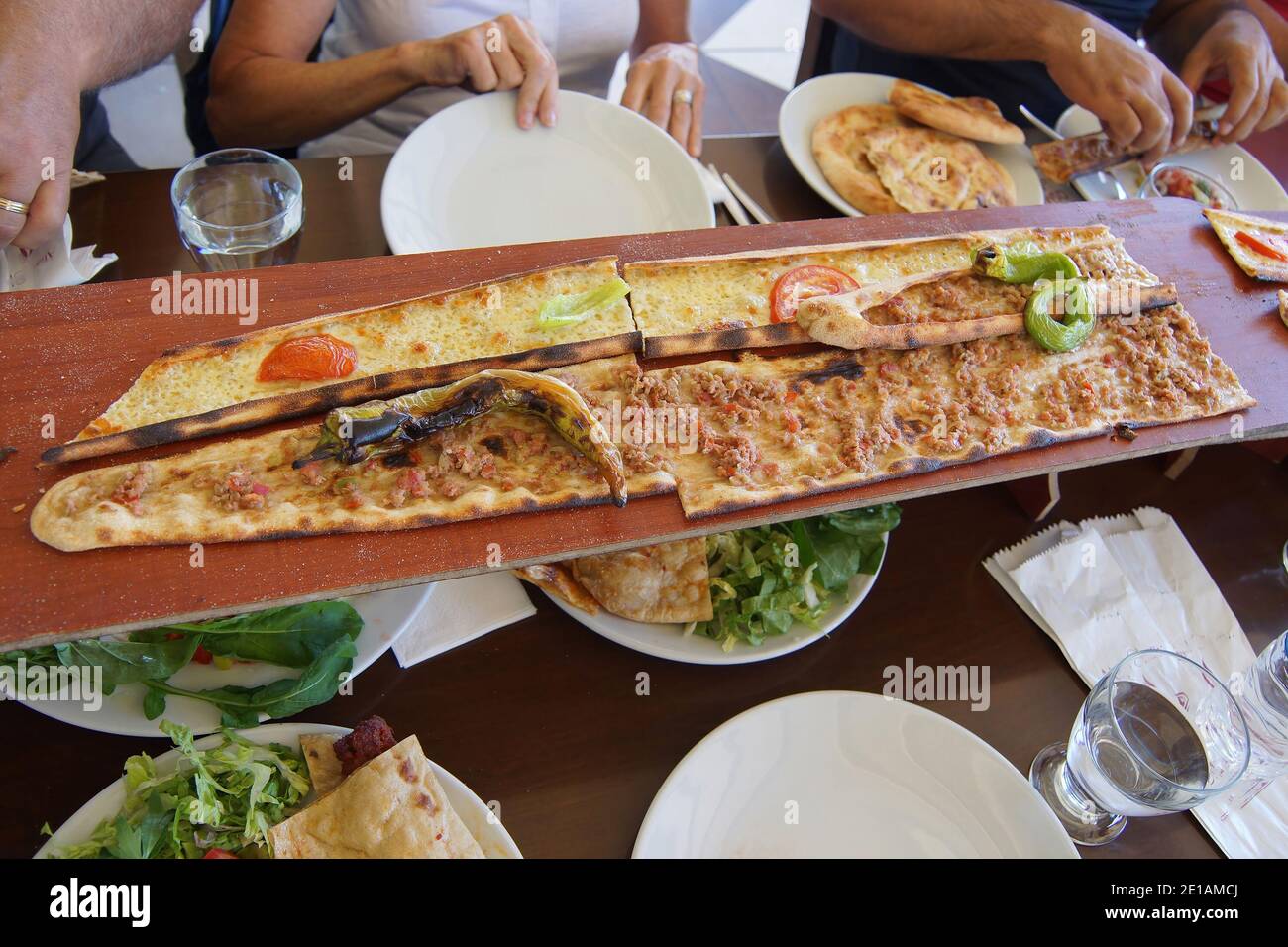 Turkish Pide pizza are served on long planks to hungry tourists  Antalya,  Turkey Stock Photo