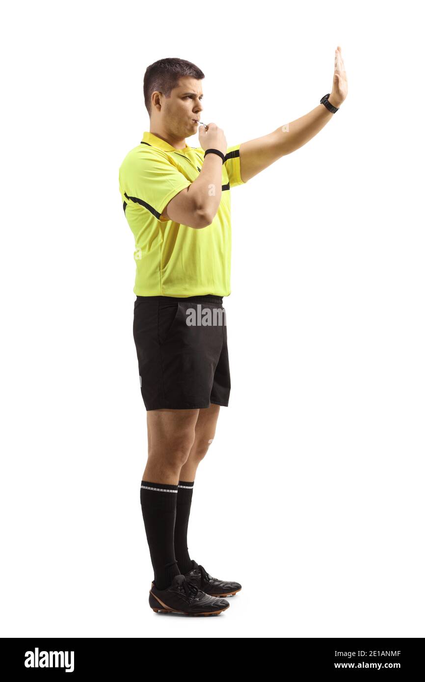 Football referee blowing a whistle and gesturing stop with hand isolated on white background Stock Photo