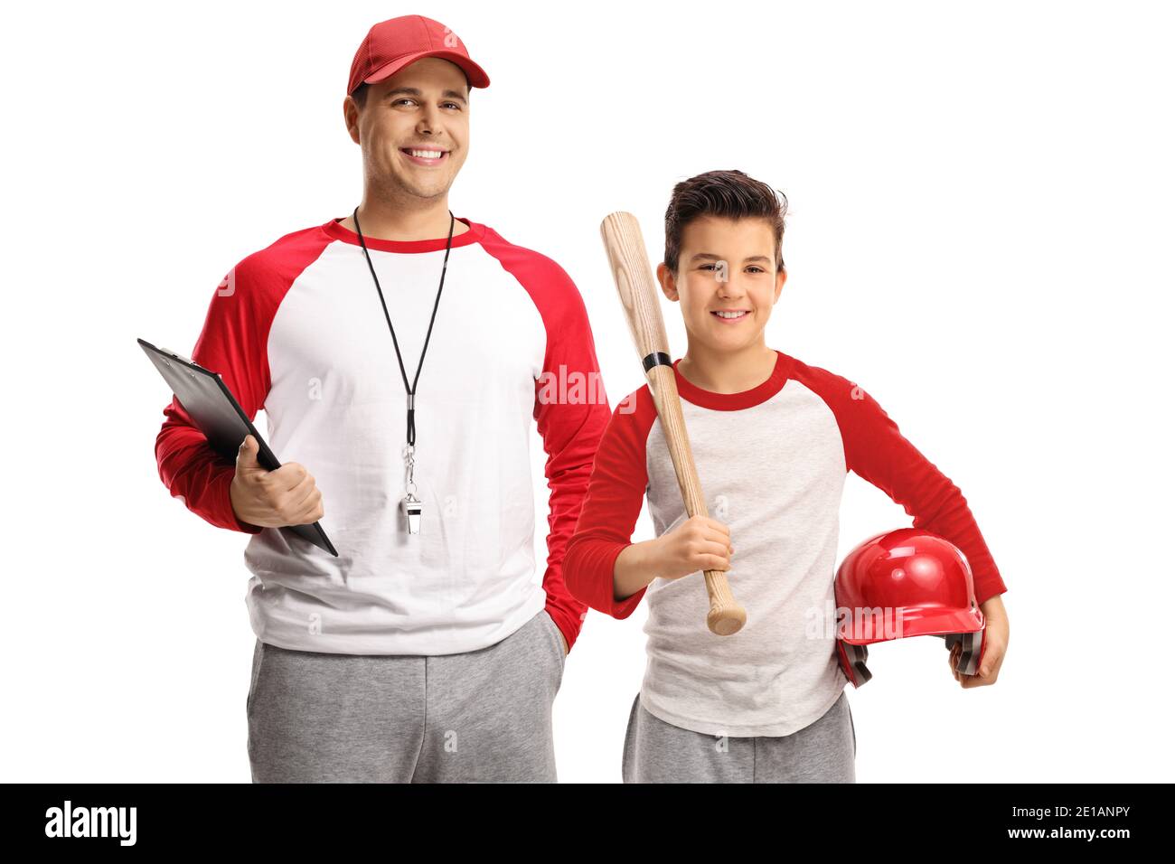 Baseball coach and a boy with a bat smiling at camera isolated on white