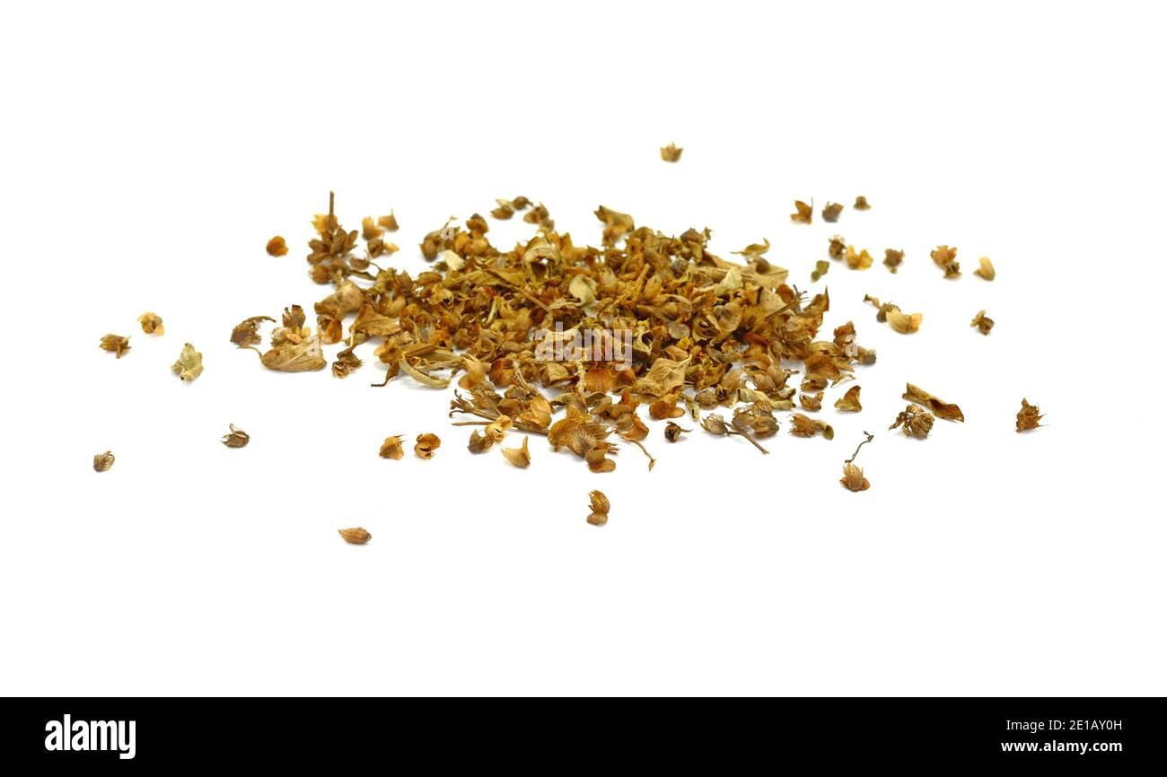 Dried natural basil spice (Ocimum basilicum). Pile of dried basil