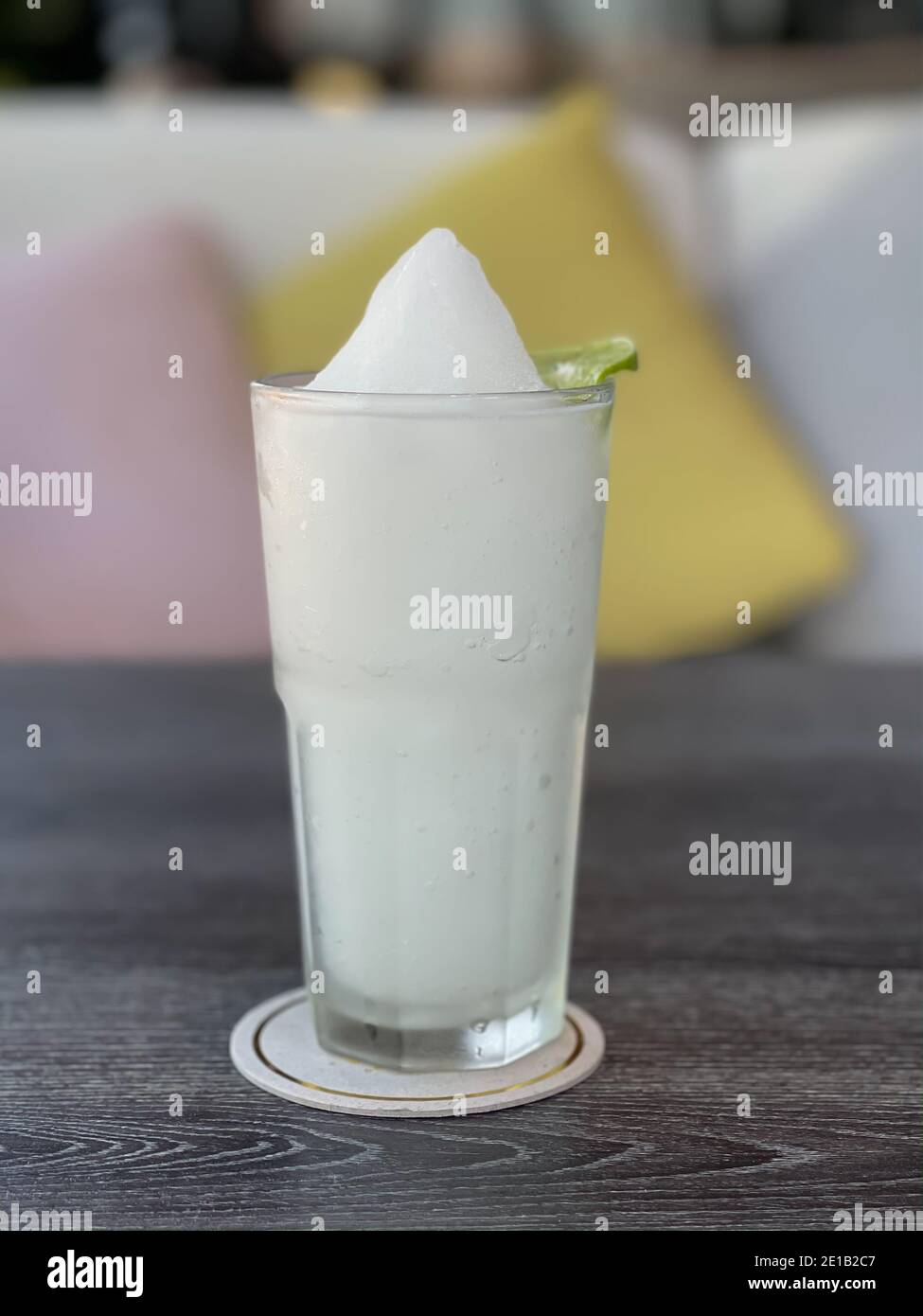 Lime smoothie in glass on grey table, stock photo Stock Photo