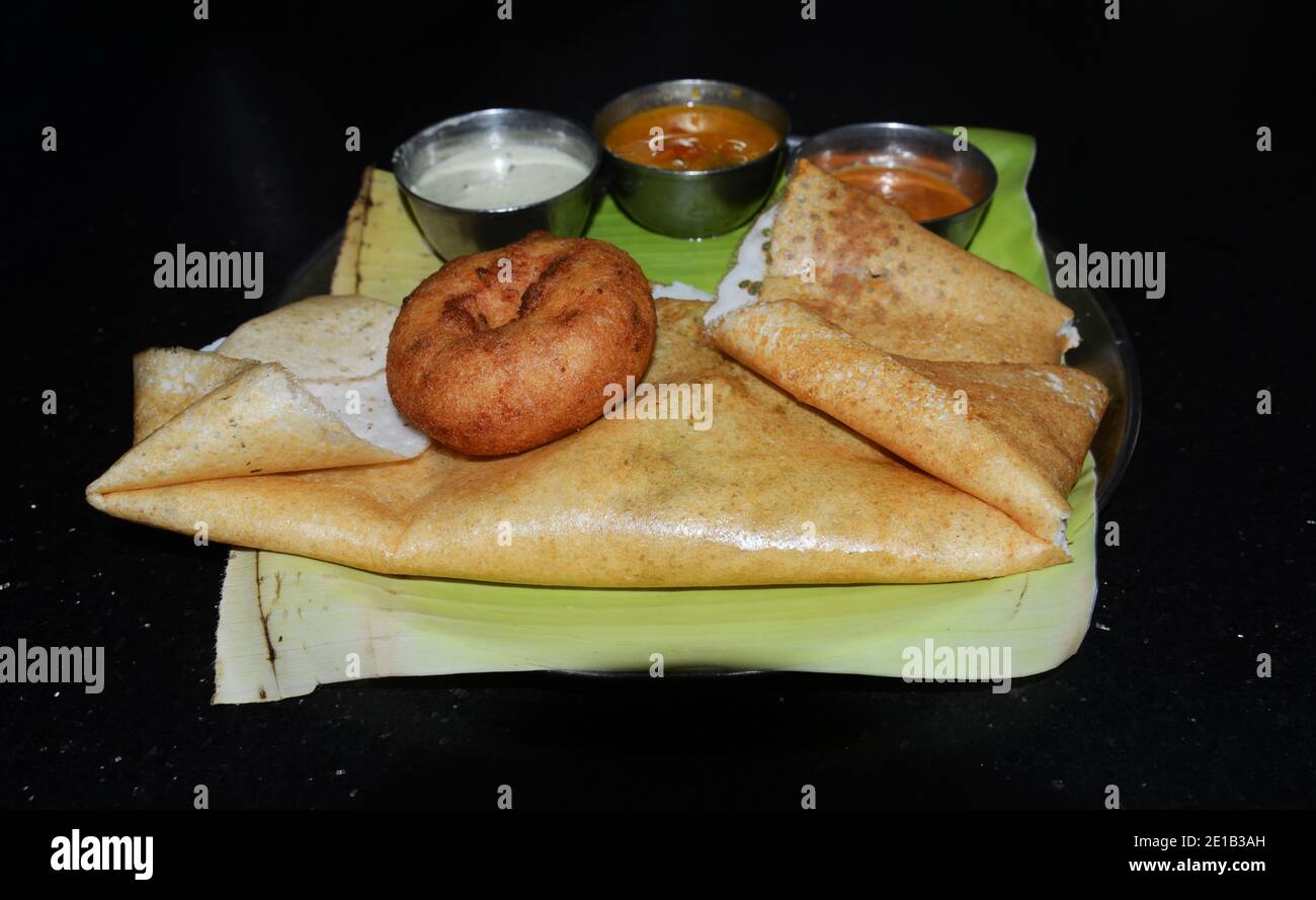 Masala Dosa served with Medu Vada and different Chutneys Stock Photo