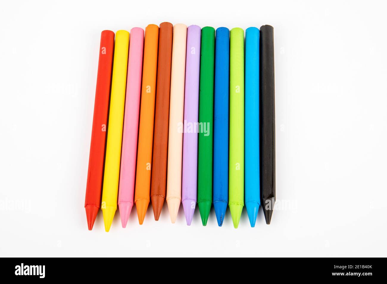 Colored wax crayons on a white background. Education and the creative process concept Stock