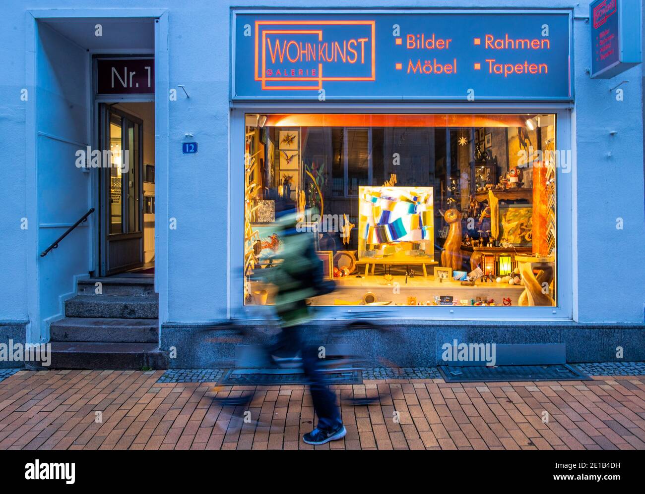 Man walks past closed shop hi-res stock photography and images - Page 2 -  Alamy