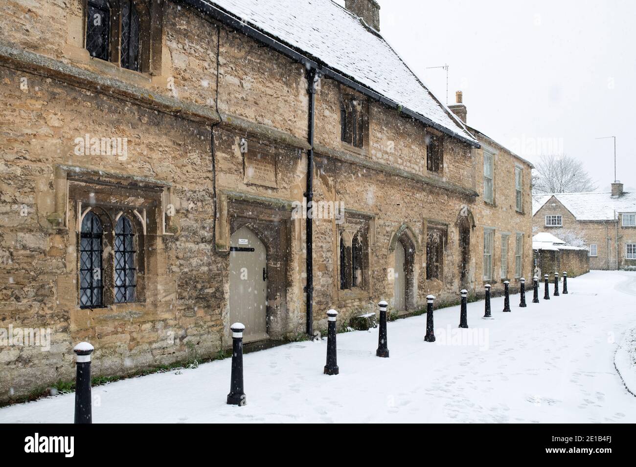The Great Almshouses along church lane in the December Snow. Burford