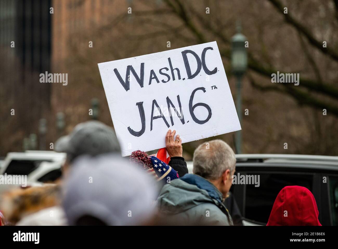 A protester holds a placard during the demonstration.Supporters of President Donald Trump urged legislators to decertify the election during the 'Hear Us Roar' rally at the Pennsylvania State Capitol. Stock Photo