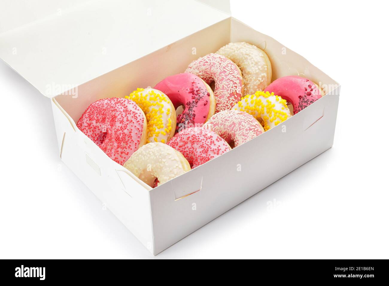 Sweet donuts in box on white background Stock Photo - Alamy