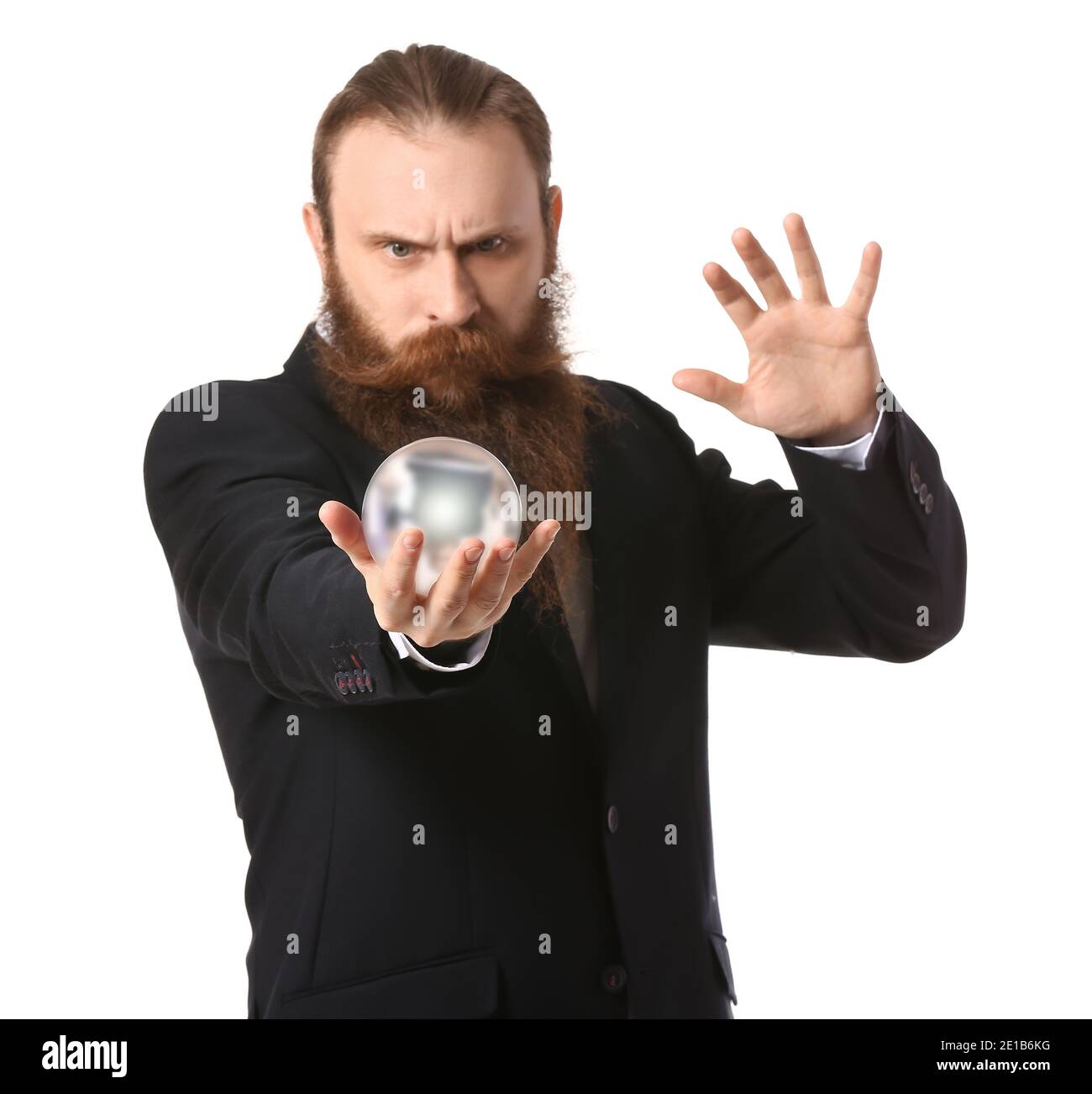 Male fortune teller with crystal ball on white background Stock Photo