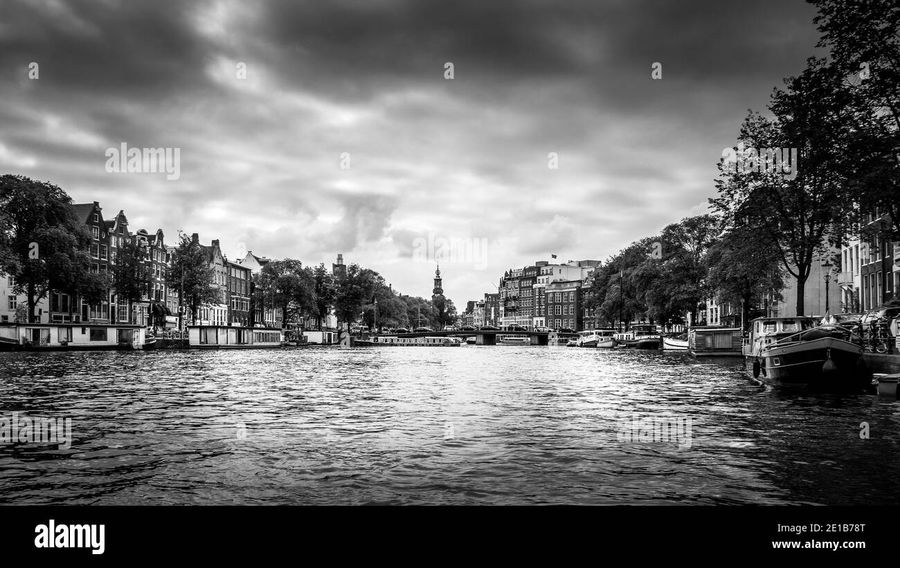 Black and White Photo of the Prinsengracht (Prince Canal) with many historic houses in the center of Amsterdam. Stock Photo