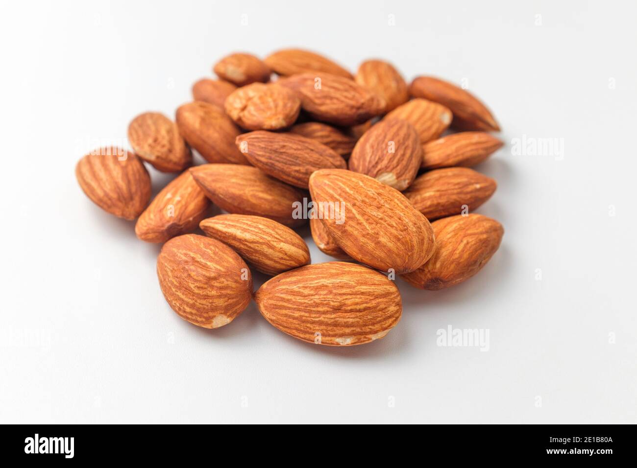 Savory almonds on white background Stock Photo