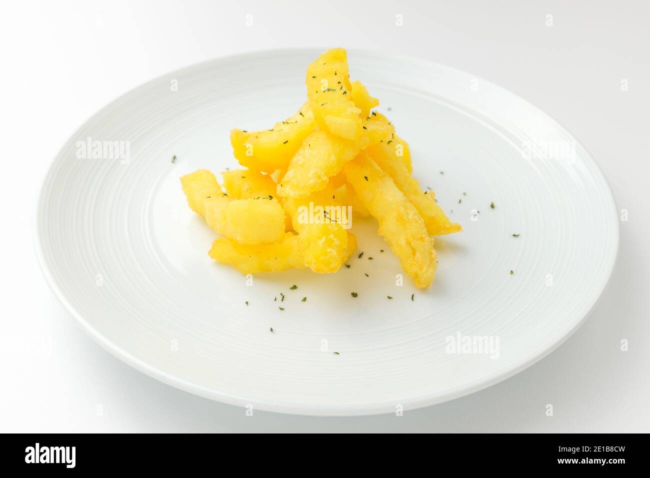 A dish of potatoes fried in oil. Fried vegetables. Tempura dishes with
