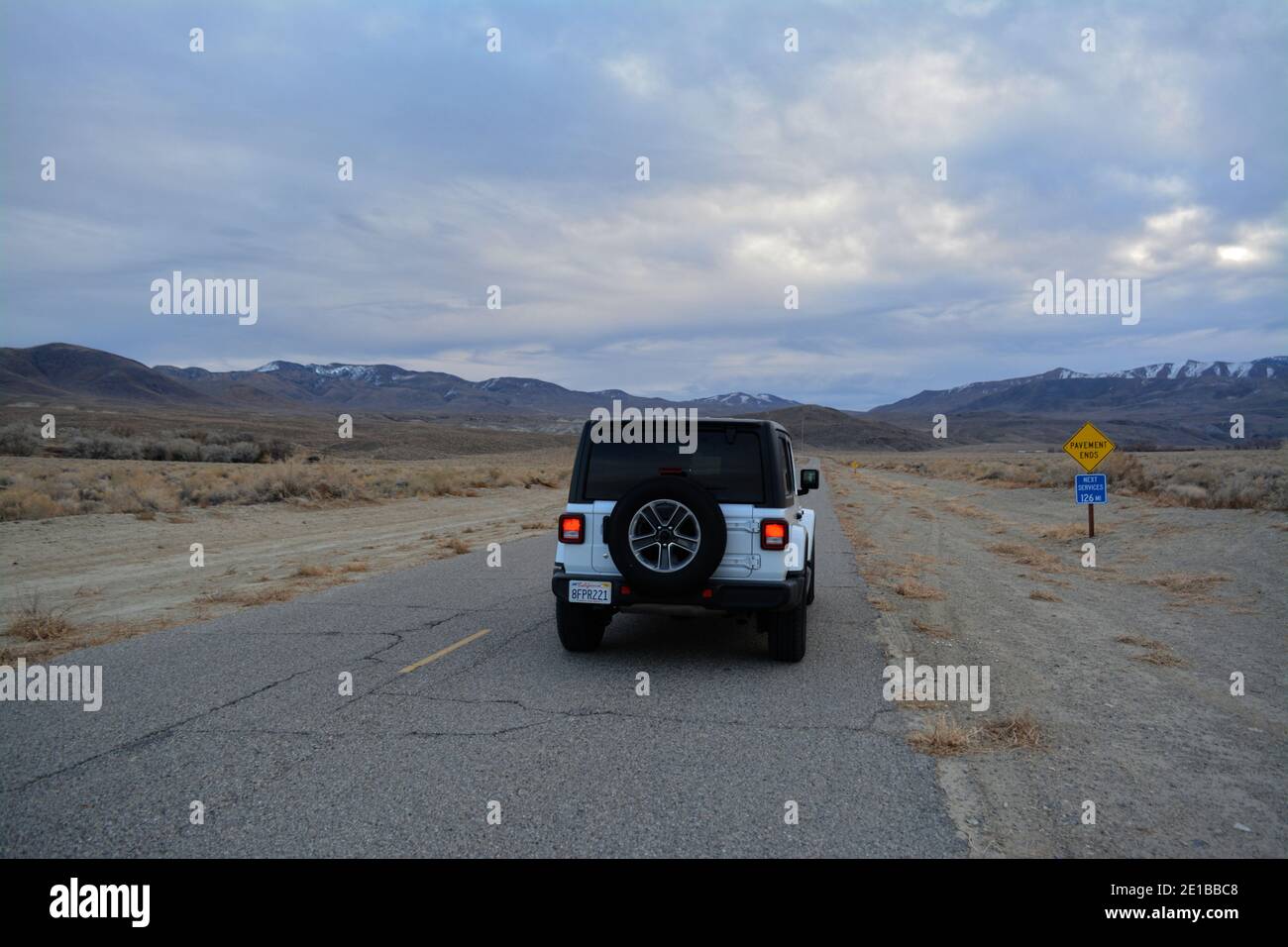 Death Valley, California, USA - December 22, 2019 - white Jeep Wrangler Sahara on the Big Pine Road Stock Photo