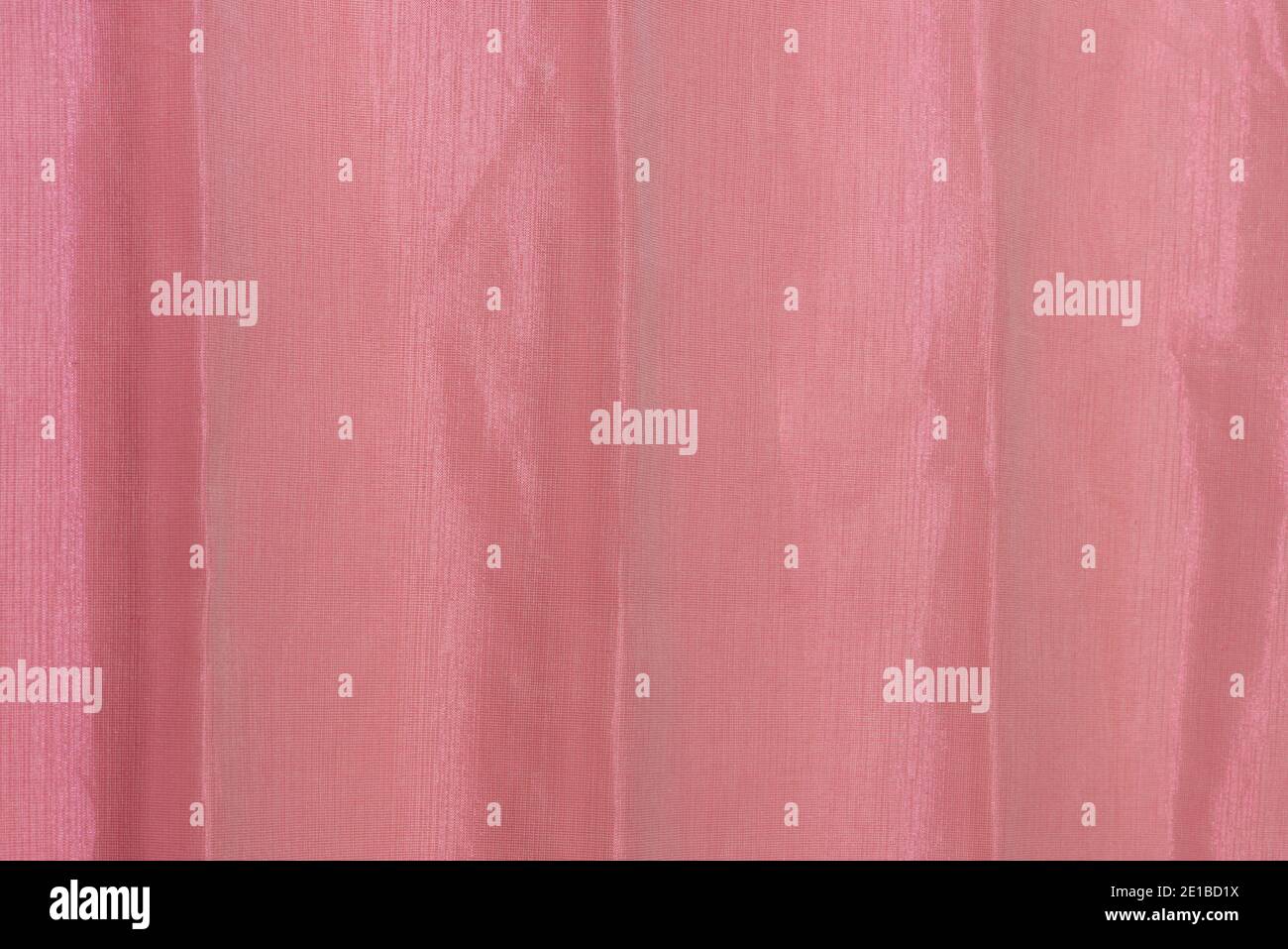 Red crumpled fabric close up. Abstract background. Stock Photo