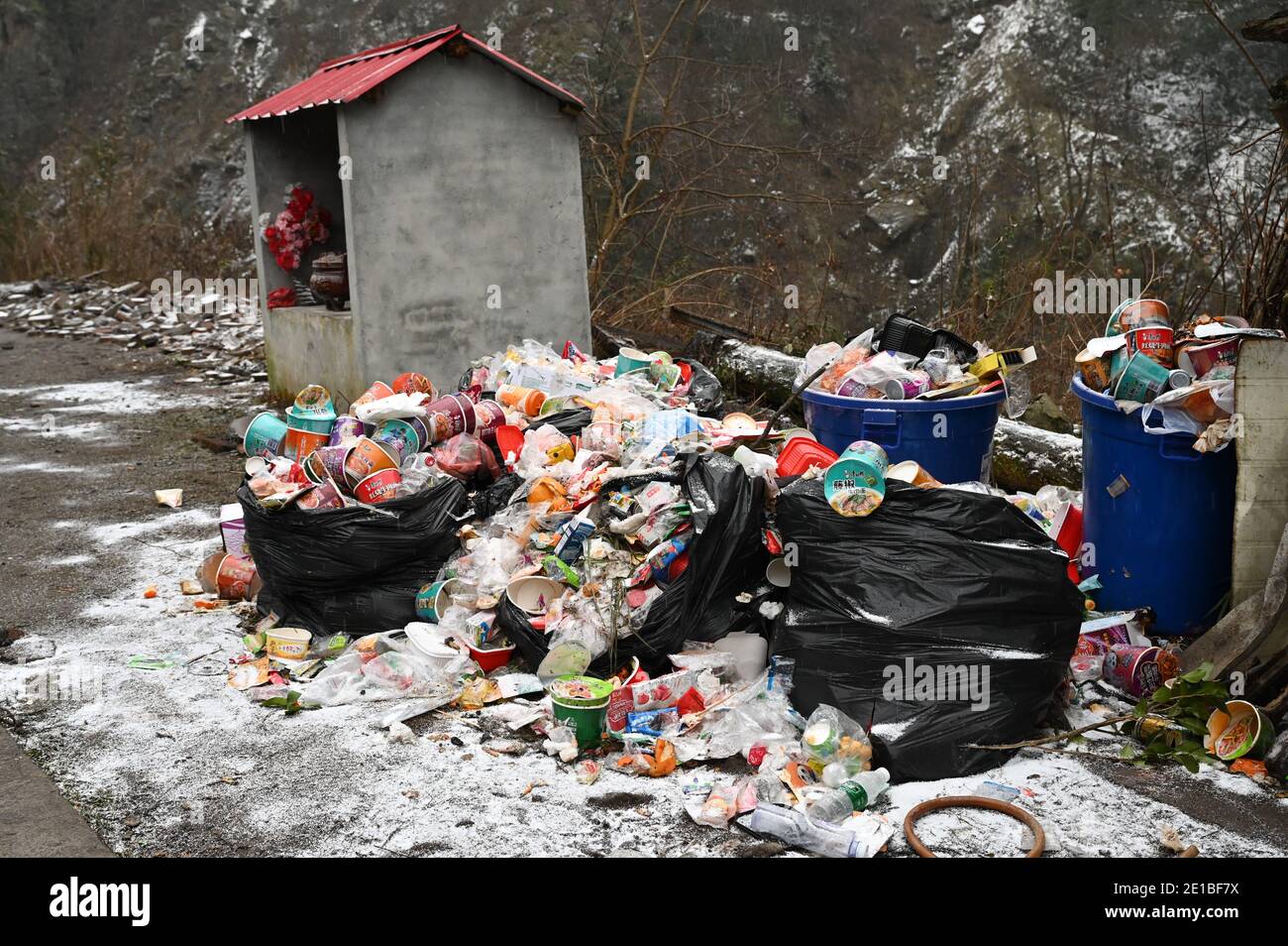The view of tourist walking in the Jiufeng mountain, where abandoned trashes are seen everywhere as tourists flock to the place, which, according to t Stock Photo