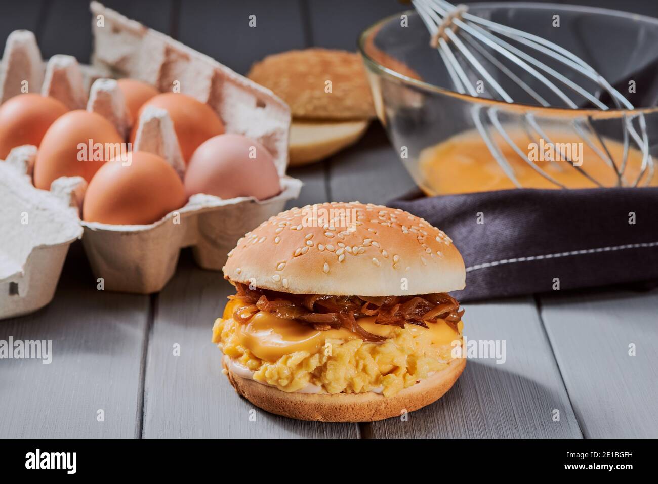 Finished burger with caramelized onion, ooeygooey cheese and eggslut