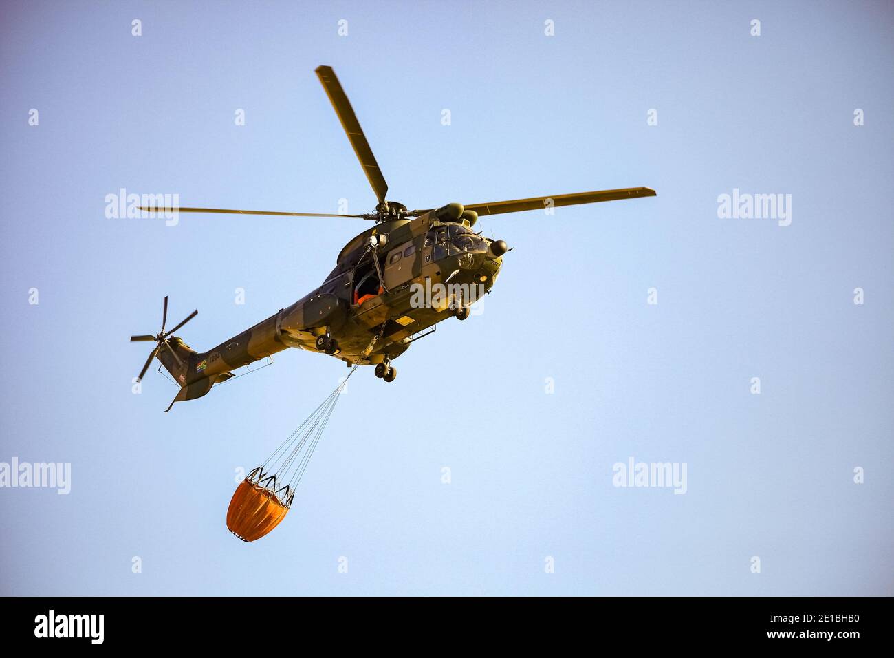Johannesburg, South Africa May 22, 2011 Military Airforce firefighting helicopter carrying