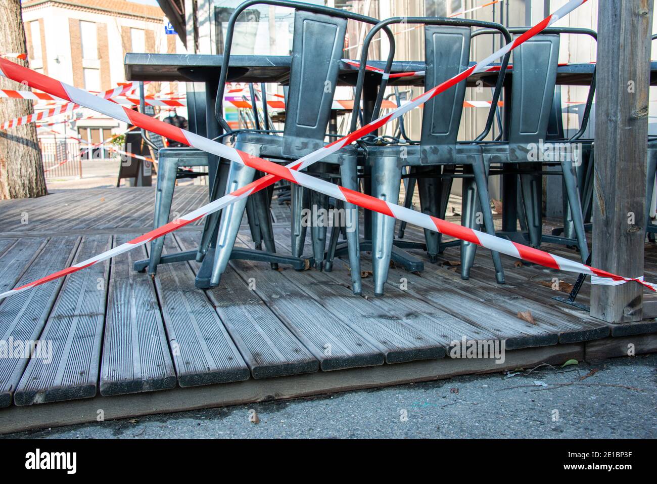 french terrace cafe closed and taped off to stop people sitting on the terrace because of coronavirus shutdown ,covid 19 . Stock Photo