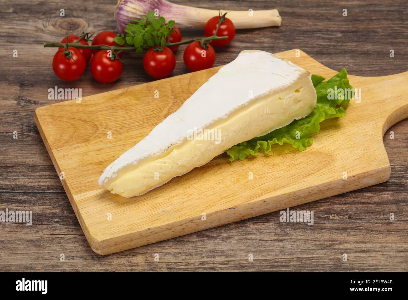 Brie cheese triangle served salad leaves Stock Photo Alamy