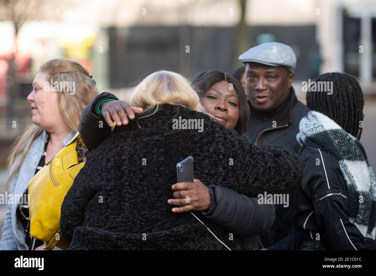 Family of Dom Ansah emabrace outside Luton Crown Court after the sentencing of Earl Bevans, 23, Charlie Chandler, 23, Clayton Barker, 20, and two 17-year-olds for the murders of Dom Ansah and Ben Gillham-Rice at a birthday party in Milton Keynes in October 2019. Stock Photo