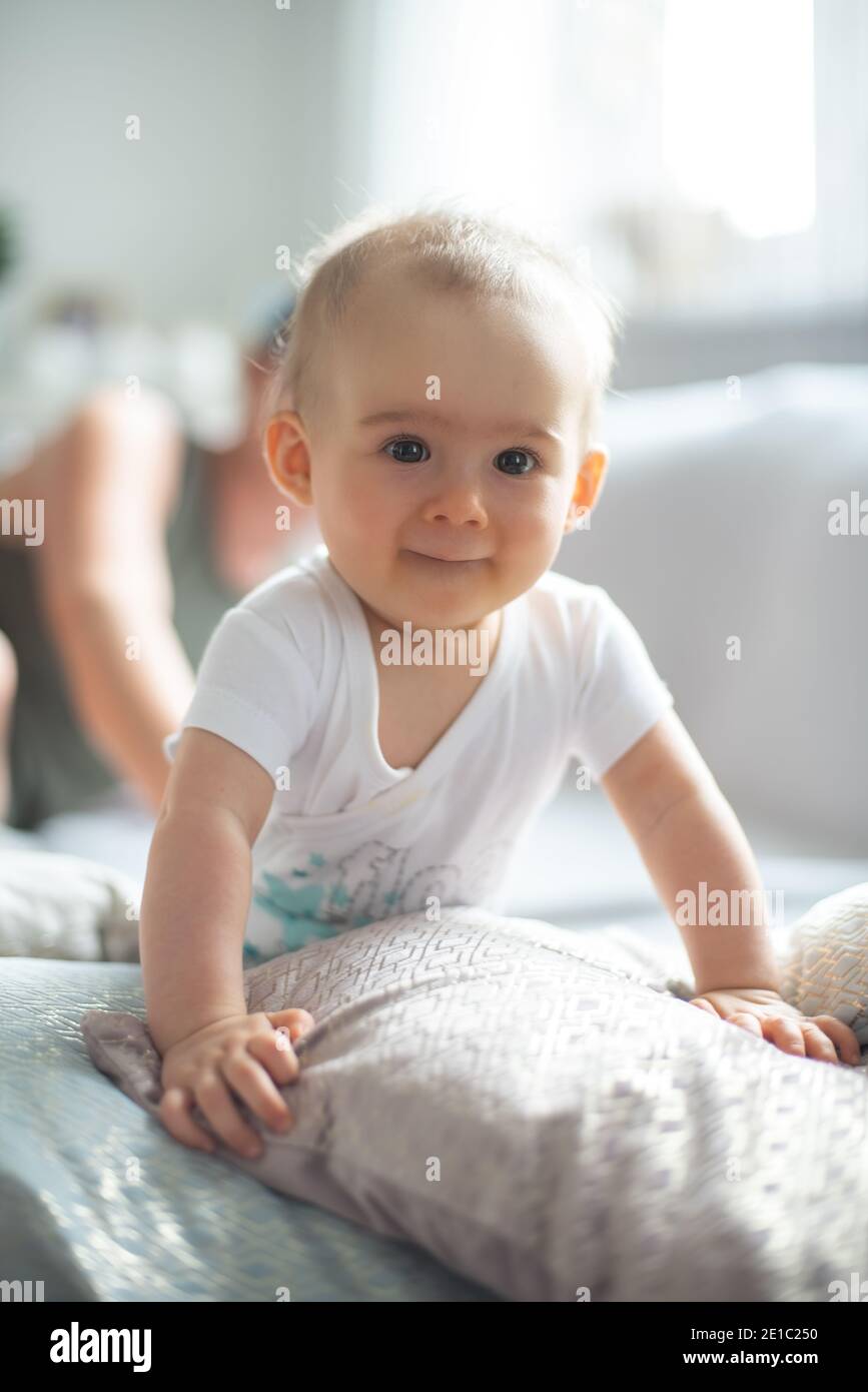 Baby lifting herself from belly up Stock Photo Alamy