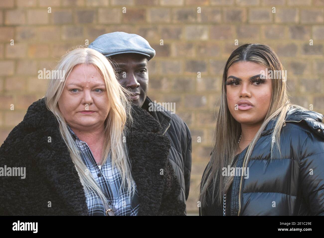 Dom Ansah's mother Tracey, dad Dominic and sister Holly, outside Luton Crown Court after the sentencing of Earl Bevans, 23, Charlie Chandler, 23, Clayton Barker, 20, and two 17-year-olds for the murders of Dom Ansah and Ben Gillham-Rice at a birthday party in Milton Keynes in October 2019. Stock Photo