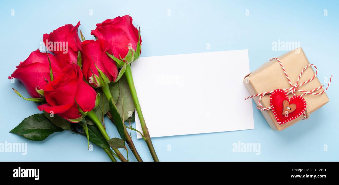 Valentines day greeting card with red rose flowers bouquet and gift box ...