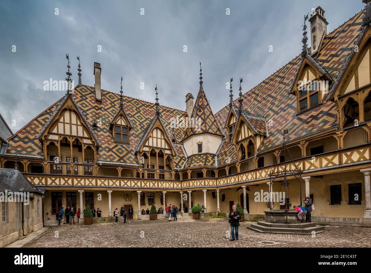 Beaune, France May 19th 2013 : The beautiful Hotel Dieu hospital museum at Beaune, famous for its polychrome roof architecture Stock Photo
