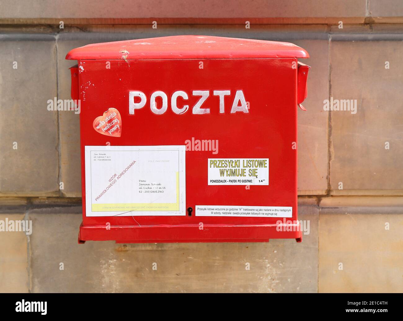 WARSAW,POLAND-MAY 16: Polish National Post red mailbox on the street of Warsaw. Polish postal service was established in 1558.May 16,2015 in Warsaw. Stock Photo
