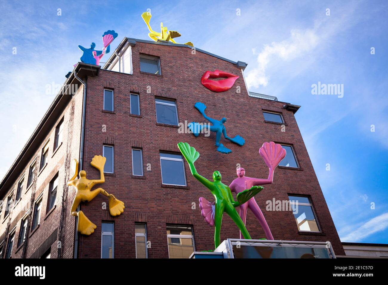 UNICEF Germany office on Hoeninger Weg in the Zollstock district, Flossi sculptures by artist Rosalie on the facade, Cologne, Germany.   Geschaeftsste Stock Photo